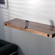 Illustration for article titled Minimalist iPhone Dock Doubles as Minimalist Shelf